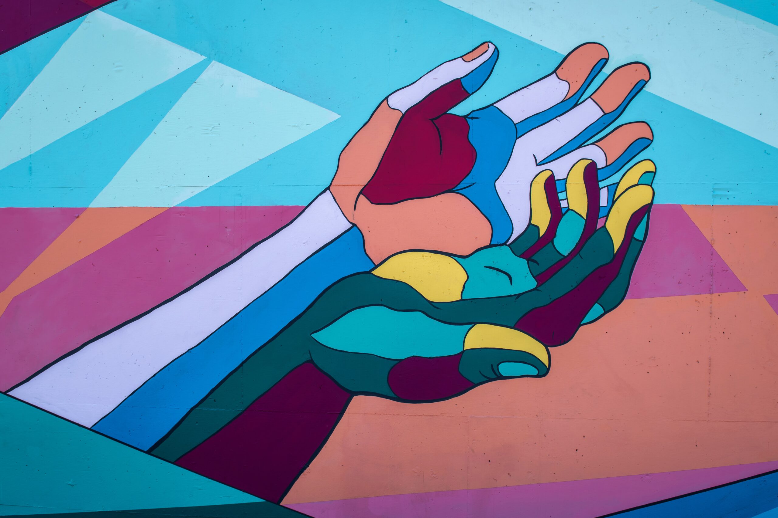 An abstract image of colourful hands to symbolize the need to keep them clean while keeping yourself mentally healthy.